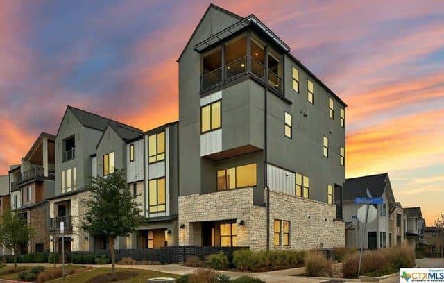 apartment complex with sun down behind it apartment complex with sun down behind it-RISK COVERAGE INSURANCE